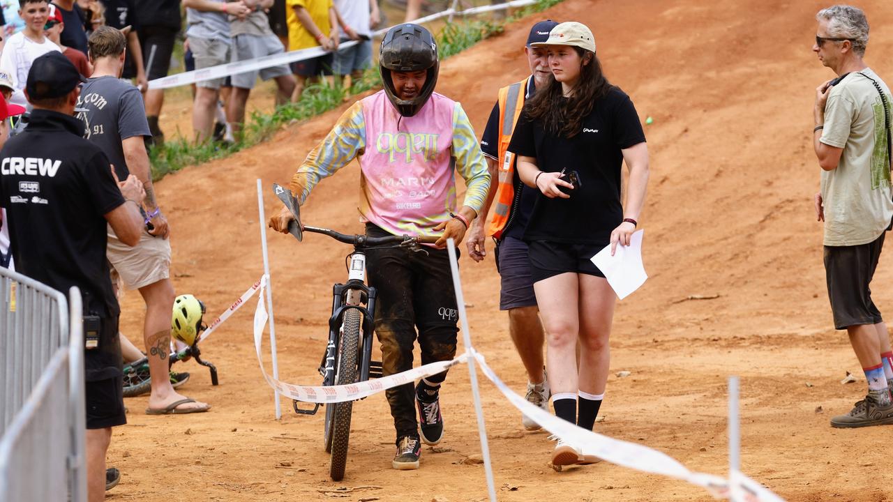 Jayden Fleming walks away after crashing hard in the National Whipoff Championship on Day One of Crankworx Cairns. Picture: Brendan Radke