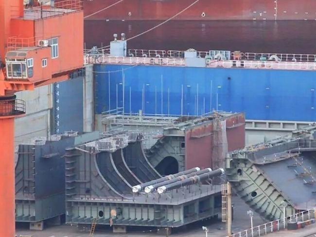 These ship components photographed last year being brought together at the Dalian shipyard are speculated as belonging to China's future third aircraft carrier. Picture: Xinhua