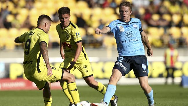 Sydney FC’s Trent Buhagiar tries to slip past the Wellington defence. Picture: Getty Images