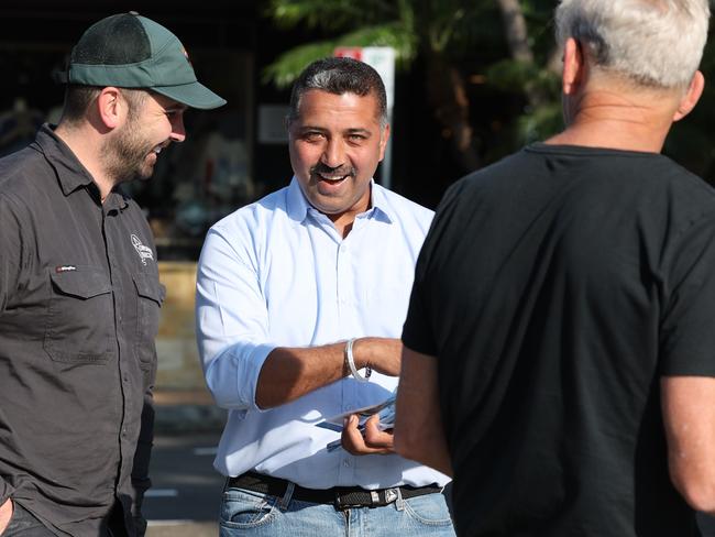 Local small businessman Mandeep “Sunny” Singh (centre) at Mona Vale Memorial Hall on Saturday. Picture: Tim Hunter.