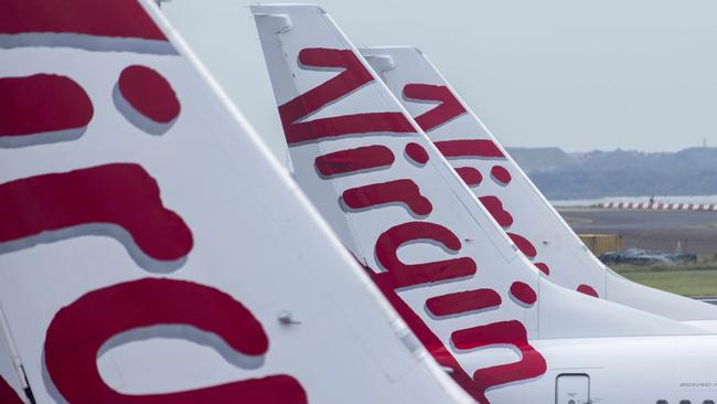 SYDNEY, AUSTRALIA - NewsWire Photos FEBRUARY 06, 2021: A general view of the tails of Virgin Australia planes at Sydney Domestic airport.  Picture: NCA NewsWire / Jenny Evans