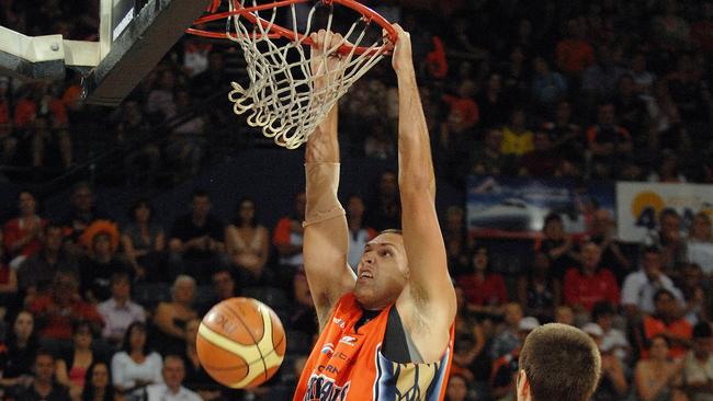 Cairns Taipans’ centre Matt Smith throws down a dunk during his NBL career in a clash with the Gold Coast Blaze. Picture: Brian Cassey