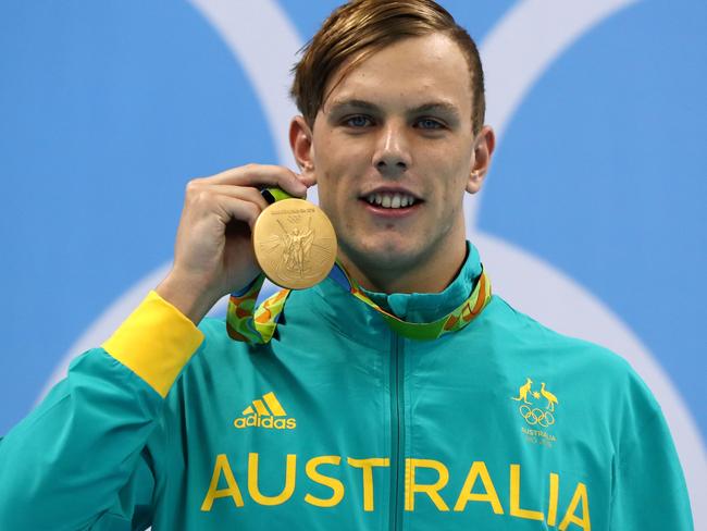 RIO DE JANEIRO, BRAZIL - AUGUST 10: Gold medalist Kyle Chalmers of Australia poses on the podium during the medal ceremony for the Men's 100m Freestyle Final on Day 5 of the Rio 2016 Olympic Games at the Olympic Aquatics Stadium on August 10, 2016 in Rio de Janeiro, Brazil. (Photo by Al Bello/Getty Images)