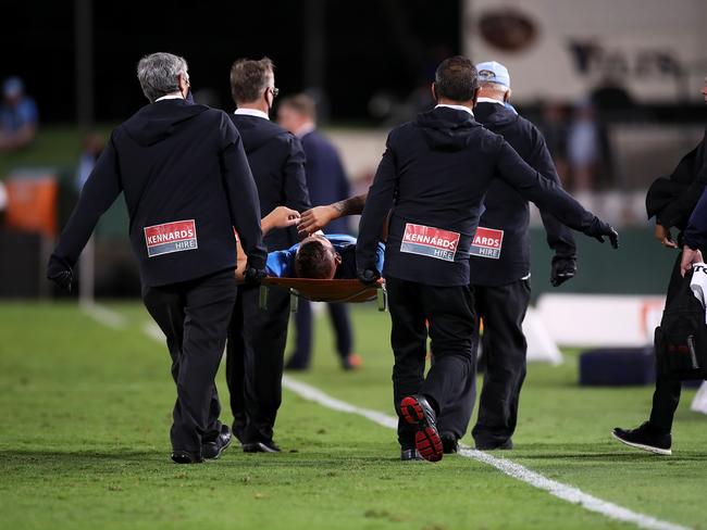 Chris Zuvela is stretchered off the field after hurting his knee in Sydney’s defeat of Wellington. Picture: Mark Kolbe/Getty Images