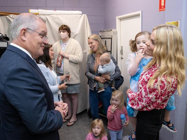 Prime Minister Scott Morrison Scott Morrison with Erin Molan, who has been the victim of online abuse. Picture: Jason Edwards ,