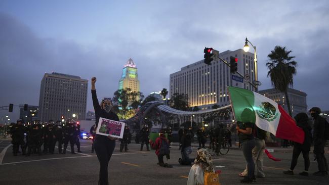 Protesters are seen in downtown Los Angeles, Sunday, June 8, 2025. Picture: AP Photo/Ethan Swope