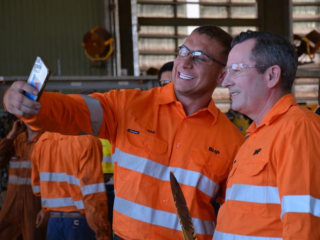 Premier Mark McGowan (R) at BHP South Flank iron ore mine, holding a  'punishment stick'. Picture by: Rebecca Le May