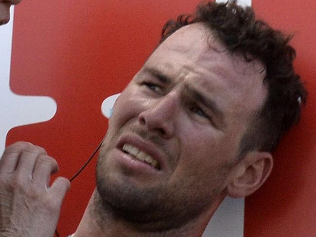 Britain's Mark Cavendish injured receives medical assistance after a fall near the finish line at the end of the 190.5 km first stage of the 101st edition of the Tour de France cycling race on July 5, 2014 between Leeds and Harrogate, northern England. The 2014 Tour de France gets underway on July 5 in the streets of Leeds and ends on July 27 down the Champs-Elysees in Paris. AFP PHOTO / JEFF PACHOUD