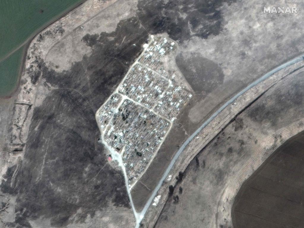 This satellite image released by Maxar Technologies shows a cemetery 12kms east of Mariupol that has expanded over the past month and includes several long trenches. Picture: AFP