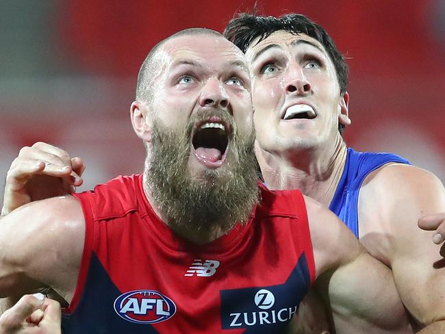 GOLD COAST, AUSTRALIA - JULY 26: Max Gawn of the Demons and Oscar McInerney of the Lions compete in the ruck during the round 8 AFL match between the Melbourne Demons and the Brisbane Lions at Metricon Stadium on July 26, 2020 in Gold Coast, Australia. (Photo by Chris Hyde/Getty Images)