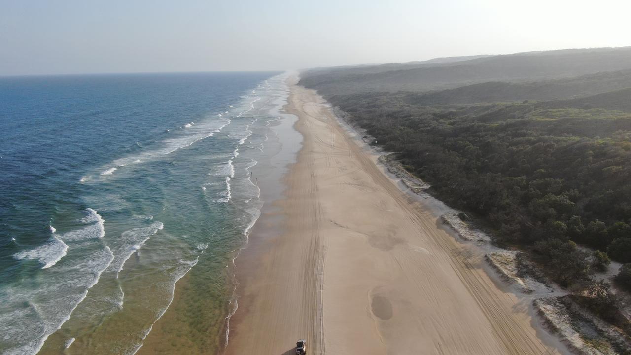 Driving on the beach on K'gari (Fraser Island), Queensland. Picture: TEQ