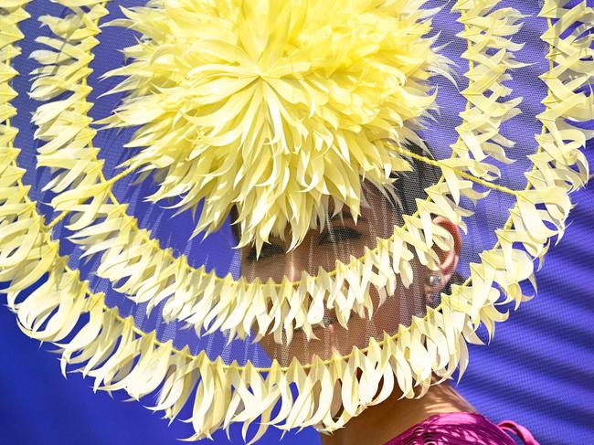 A woman competes in the 'Fashion in the Field' event before the start of the Melbourne Cup horse race at the Flemington Racecourse. Picture: William West/AFP