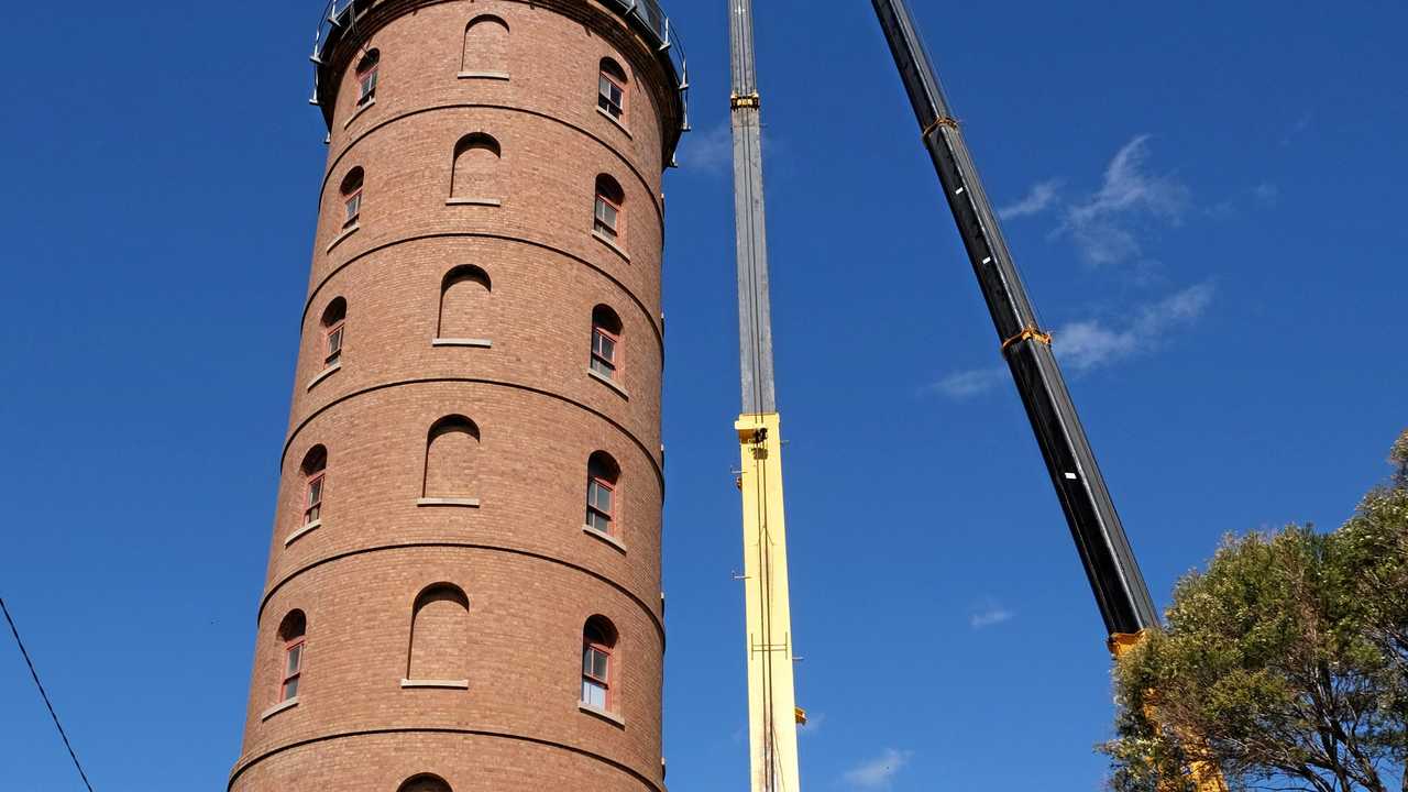 REPAIR JOB: The roof is atop a steel water tank that sits on the eight-storey tower, the only one of its kind in Queensland. Picture: Mike Knott BUN041018TOWER3