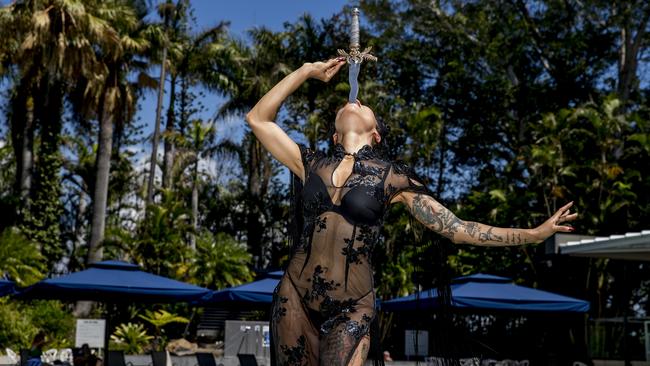 Ms Holliday demonstrates one of her sword tricks. Picture: Jerad Williams