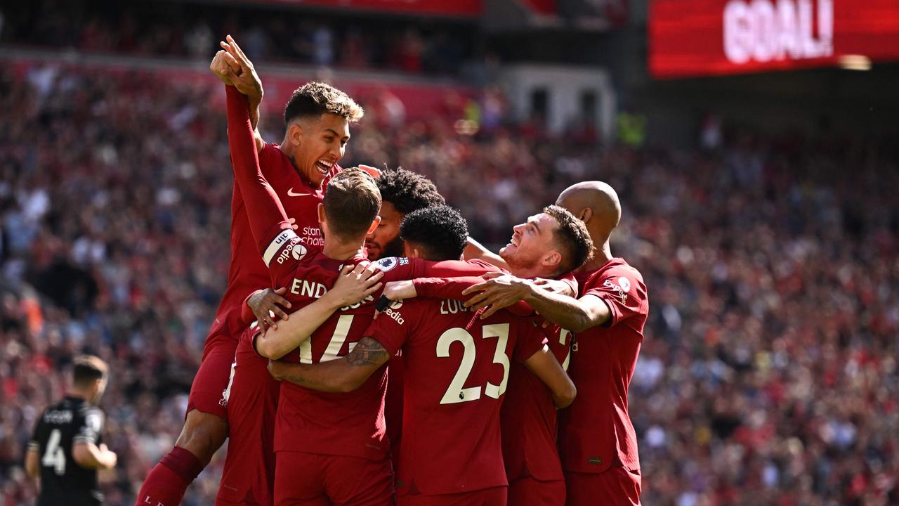 Liverpool's Luis Diaz celebrates with teammates after scoring their first goal. Photo by Oli SCARFF / AFP.