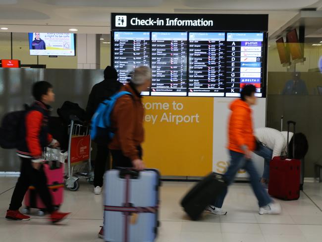 SYDNEY, AUSTRALIA  - AUGUST 15 2023: A general view of the Departures Terminal at Sydney International Airport, after a man who forced a Malaysia Airlines plane to make a dramatic turn back to Sydney International Airport after he became unruly and made references to Islam has been arrested. The MH122 Airbus-a330 flight to Kuala Lumpur was diverted back to Sydney and was isolated on the tarmac with AFP officers called to the emergency just before 4pm on Monday. Picture: NCA Newswire / Gaye Gerard