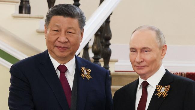 Russia's President Vladimir Putin greets Chinese President Xi Jinping. Picture: Mikhail METZEL / POOL / AFP