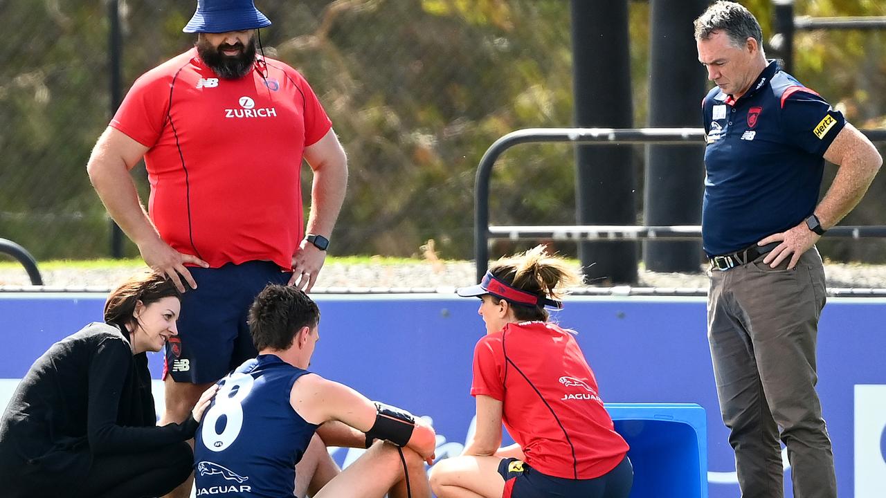 Alan Richardson (right) listens in as medical staff talk to Lever after he collapsed. Picture: Getty Images