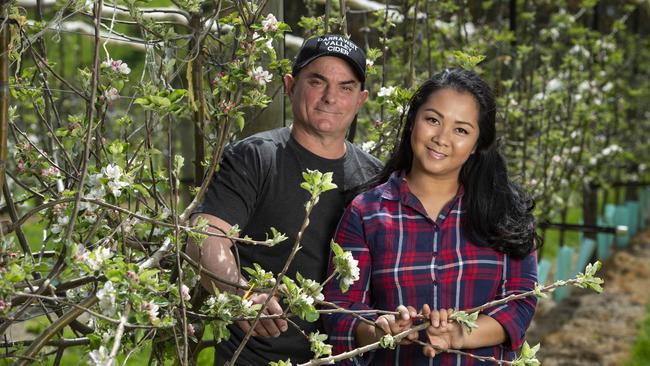 Tree change: Marc and Jenny in their orchard at Darraweit Guim. Picture: Zoe Phillips