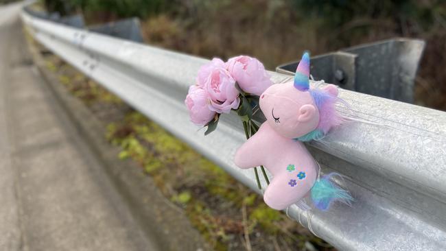 Floral tributes and a small toy unicorn lay at the fatal crash site on Algona Road, where a Huntingfield father and his young daughter were killed in a car crash. Photo: Phil Young.