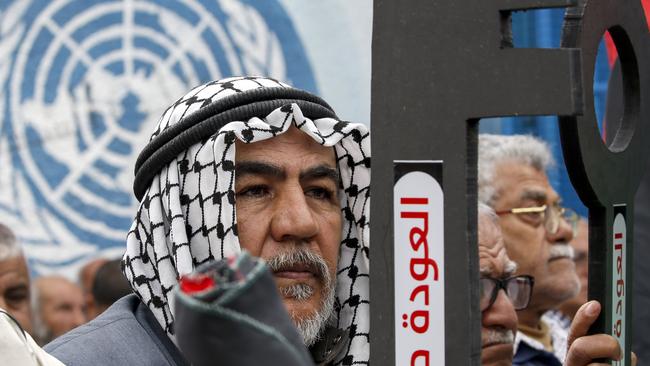 Palestinian refugees hold a key symbolising the "right of return" and a phrase in Arabic "return right like the sun" during a protest against a US-brokered peace proposal, next the UN building in Gaza City on February 20, 2020. US President Donald Trump's January 28 plan paves the way for Israeli annexation of much of the West Bank but also allows for a demilitarized Palestinian state. Picture: MOHAMMED ABED / AFP