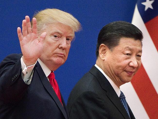 (FILES) This file picture taken on November 9, 2017 shows US President Donald Trump (L) and China's President Xi Jinping leaving a business leaders event at the Great Hall of the People in Beijing. - The US has rejected Beijing's offer to hold preparatory talks in Washington ahead of next week's high-level trade delegation, according to media reports on January 22, 2019. The reports by The Financial Times and CNBC sent US stocks sharply lower, reviving fears that efforts to resolve the US-China trade war could fail. (Photo by Nicolas ASFOURI / AFP)