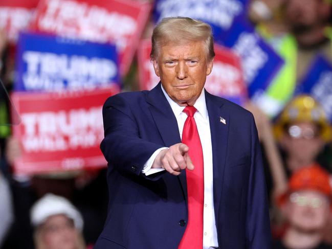 Former US President and Republican presidential candidate Donald Trump gestures during a campaign rally at PPG Paints Arena in Pittsburgh, Pennsylvania on November 4, 2024. (Photo by CHARLY TRIBALLEAU / AFP)