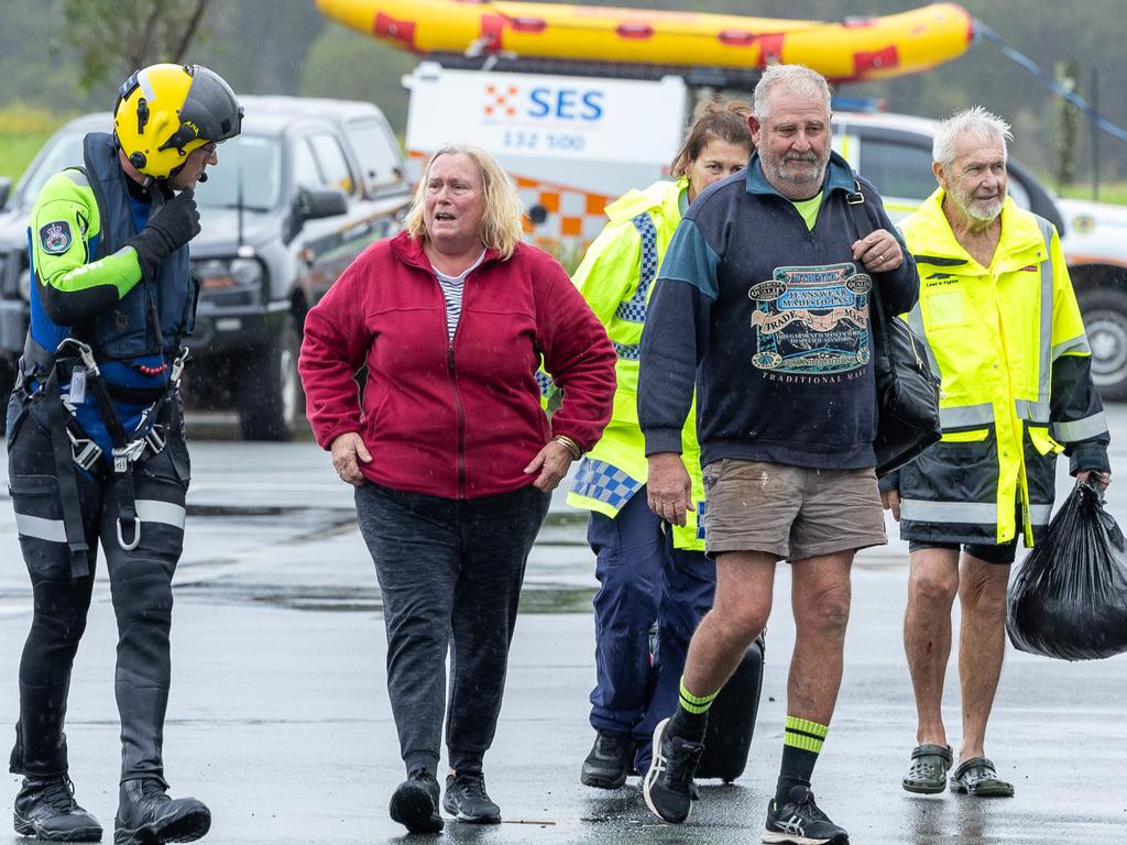 Paul and Elizabeth Brennan and dog Trixie have been saved by helicopter from flood waters at their Taree home. Picture Thomas Lisson