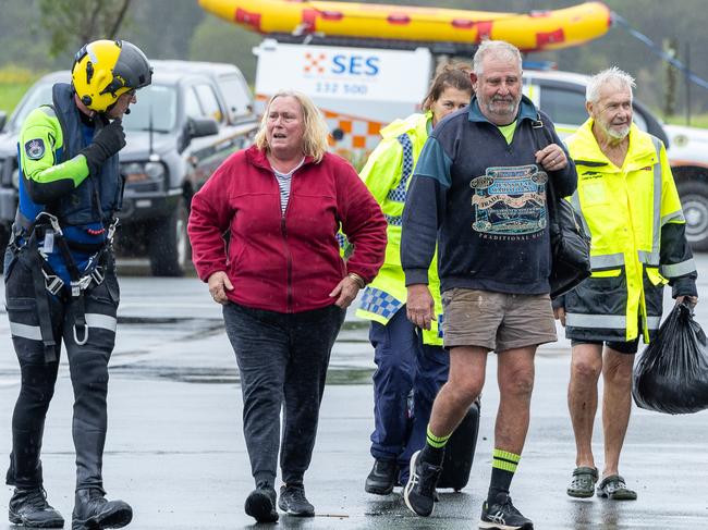Paul and Elizabeth Brennan and dog Trixie have been saved by helicopter from flood waters at their Taree home. Picture Thomas Lisson