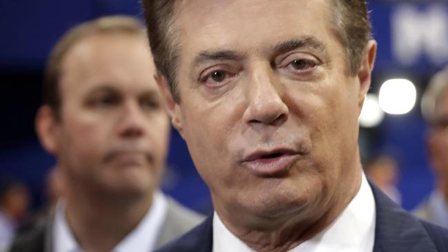 In the foreground is Paul Manafort, the most senior of the three men. Richard Gates can be seen in the background. Pic: AP