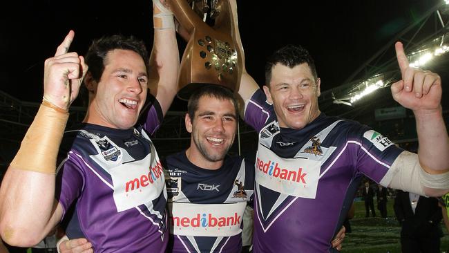 Brett White, Smith and Ben Cross with the 2007 premiership — the trophy later stripped.