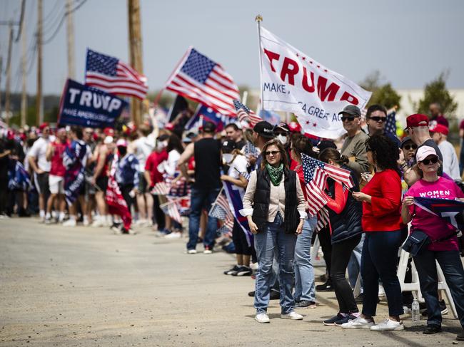 Supporters line the side of the road waiting for the motorcade of President Donald Trump to drive past on Thursday, May 14, 2020, in Allentown, Pa. Picture: AP