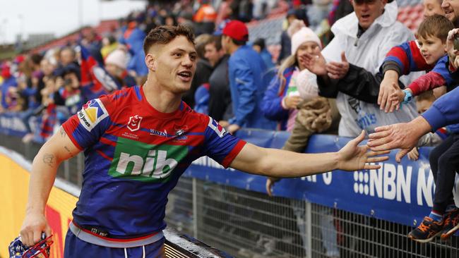 Ponga does his bit for those that did turn up. Photo: AAP Image/Darren Pateman