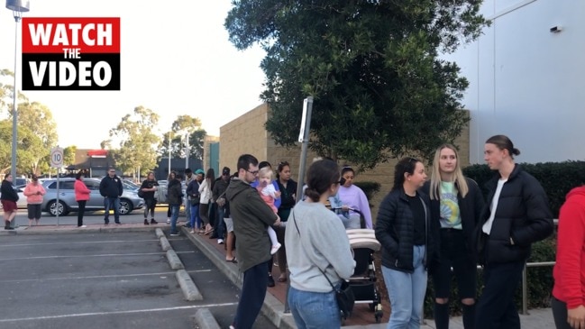 Queues of people line up for free doughnuts at Krispy Kremes in Penrith