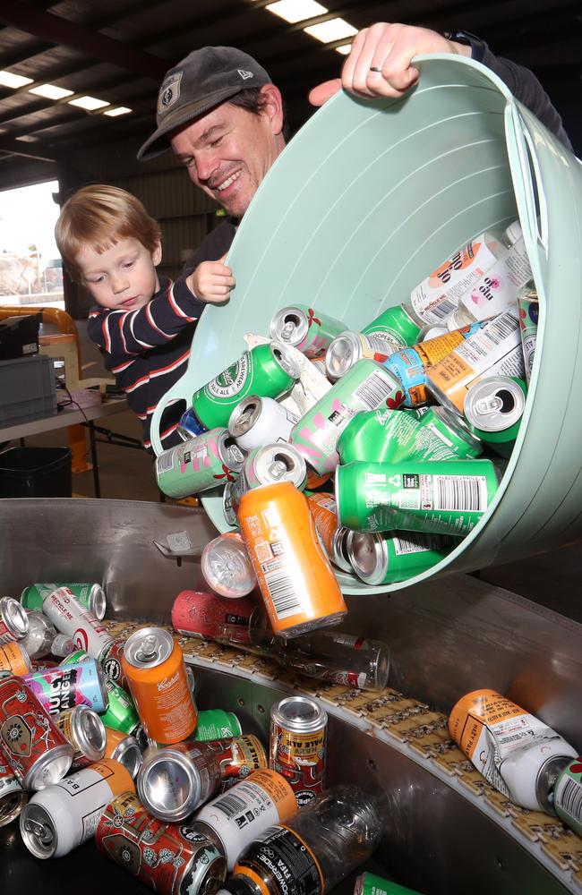 Paul and Mac Jackson, are among residents making the most of recycling containers through the CDS, as they unload a wagon of cans and plastic bottles. Picture: Alan Barber