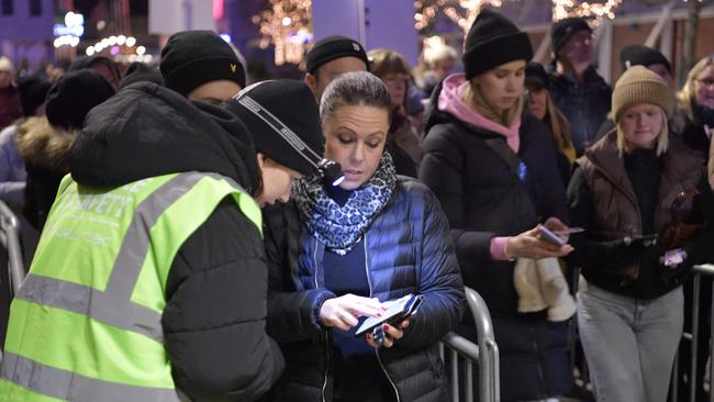 People have their Covid vaccination certificates checked at the entrance of the Avicii Arena before the Together For A Better Day concert in Stockholm.