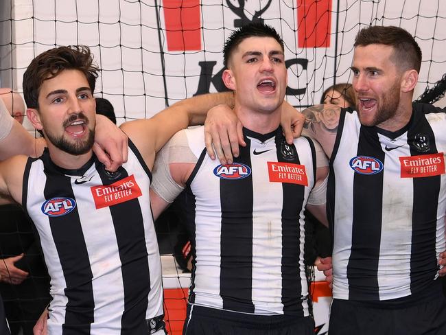 MELBOURNE, AUSTRALIA - SEPTEMBER 07: Darcy Cameron, Josh Daicos, Brayden Maynard, Jeremy Howe and Tom Mitchell of the Magpies sings the song in the rooms after winning the AFL First Qualifying Final match between Collingwood Magpies and Melbourne Demons at Melbourne Cricket Ground, on September 07, 2023, in Melbourne, Australia. (Photo by Quinn Rooney/Getty Images)