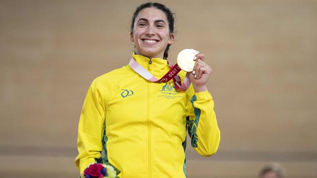 Paige Greco shows off her gold medal.