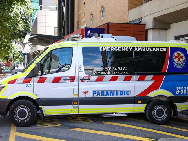 MELBOURNE, AUSTRALIA - NewsWire Photos 18 JANUARY 2022 : VictoriaÃs hospital system is under extreme pressure due to the covid-19 Omicron variant and a ÃCode brownÃ has been enforced.This will enable hospitals to cancel their staffs leave to ensure an adequate workforce is on hand. An ambulance at the Royal Melbourne Hospital. Picture : NCA NewsWire / Ian Currie