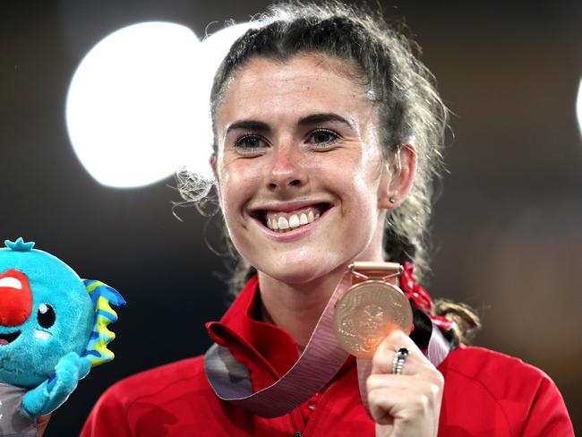 Olivia Breen celebrates with her bronze medal in the Women’s T38 100m Final at the 2018 Commonwealth Games.