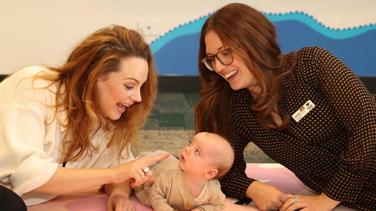 Madison Papas with 11-week-old Goldie and midwife Serena Pellizzeri from Barwon Health. Picture: Alison Wynd.