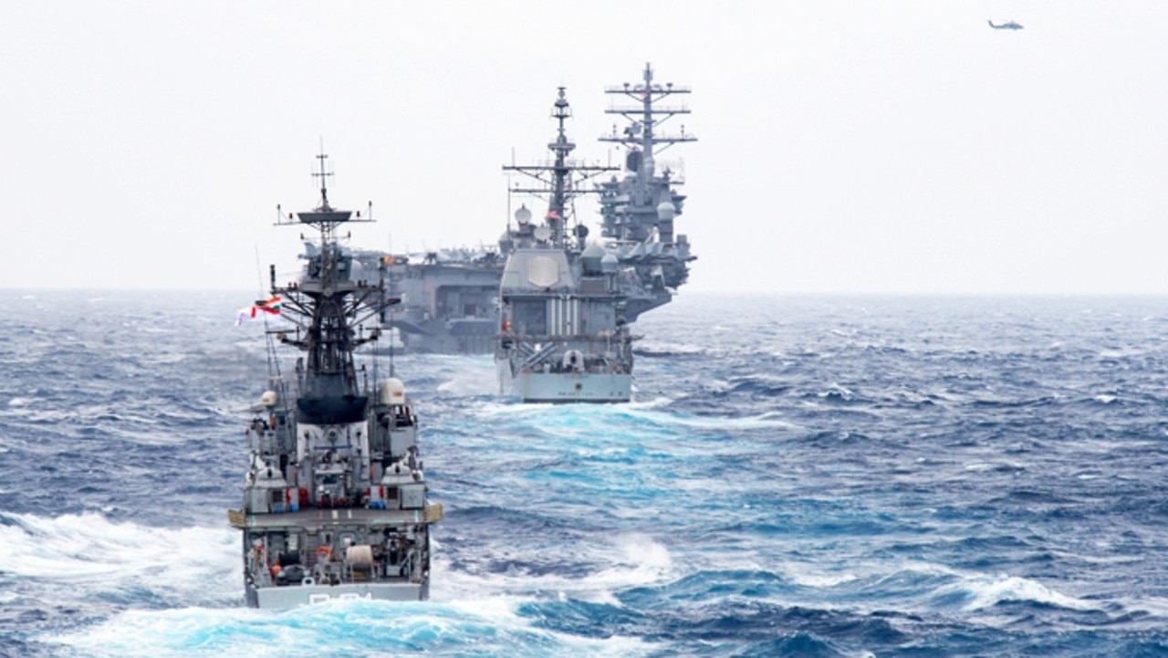 The Kora-class corvette INS Kora (P 61) steams behind the guided-missile cruiser USS Princeton (CG 59) and the aircraft carrier USS Nimitz (CVN 68) during Malabar 2017. Picture: US Navy