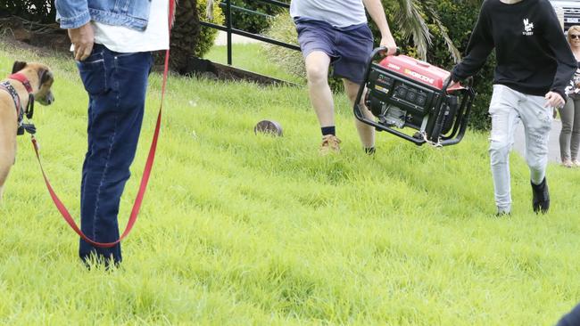 An apparent generator is carried up a hill. Picture: Matrix