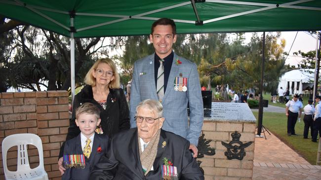 World War II Veteran Adrian Nall, 102, with his great grandson Max Mullins, 5, his grandson Christopher Mullins, and his step daughter Janet Mullins. Kawana dawn service, Anzac Day, 2024. Picture: Madeline Grace