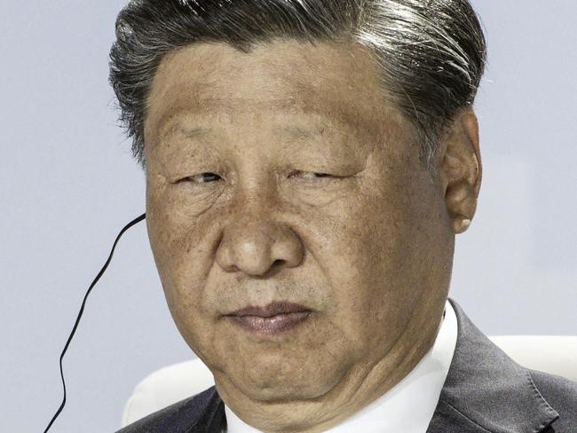 President of China Xi Jinping looks on at a meeting during the 2023 BRICS Summit at the Sandton Convention Centre in Johannesburg on August 24, 2023. (Photo by MARCO LONGARI / AFP)