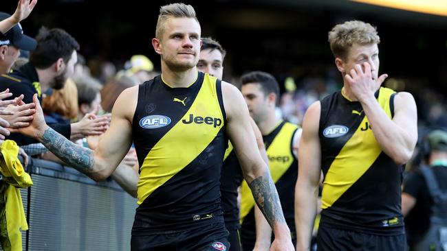 Richmond players celebrate a win with their fans. Picture: AAP Images