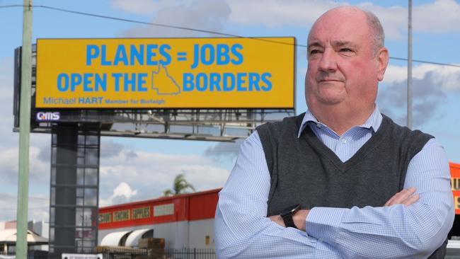 Qld MP Michael Hart in front of the Burleigh billboard. Picture: Glenn Hampson