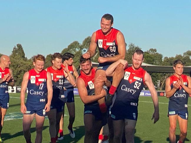 Jack Hutchins carried off after 100th VFL game