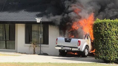 The fire engulfing the car and house. Picture: Phil Pope