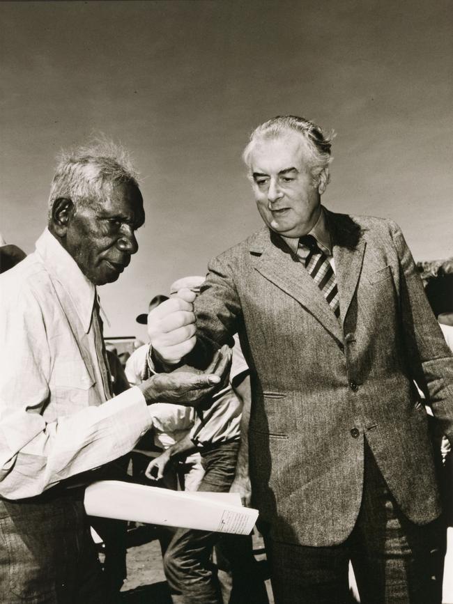 Gough Whitlam pouring soil into the hand of Vincent Lingiari, 1975.